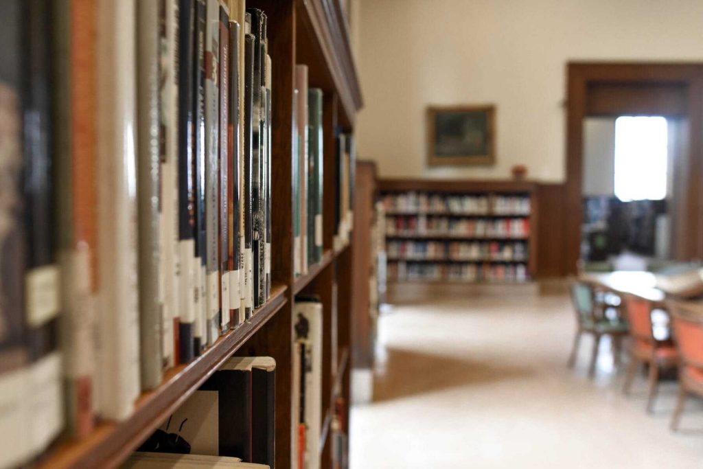 An image of a library full of books in a shelf
