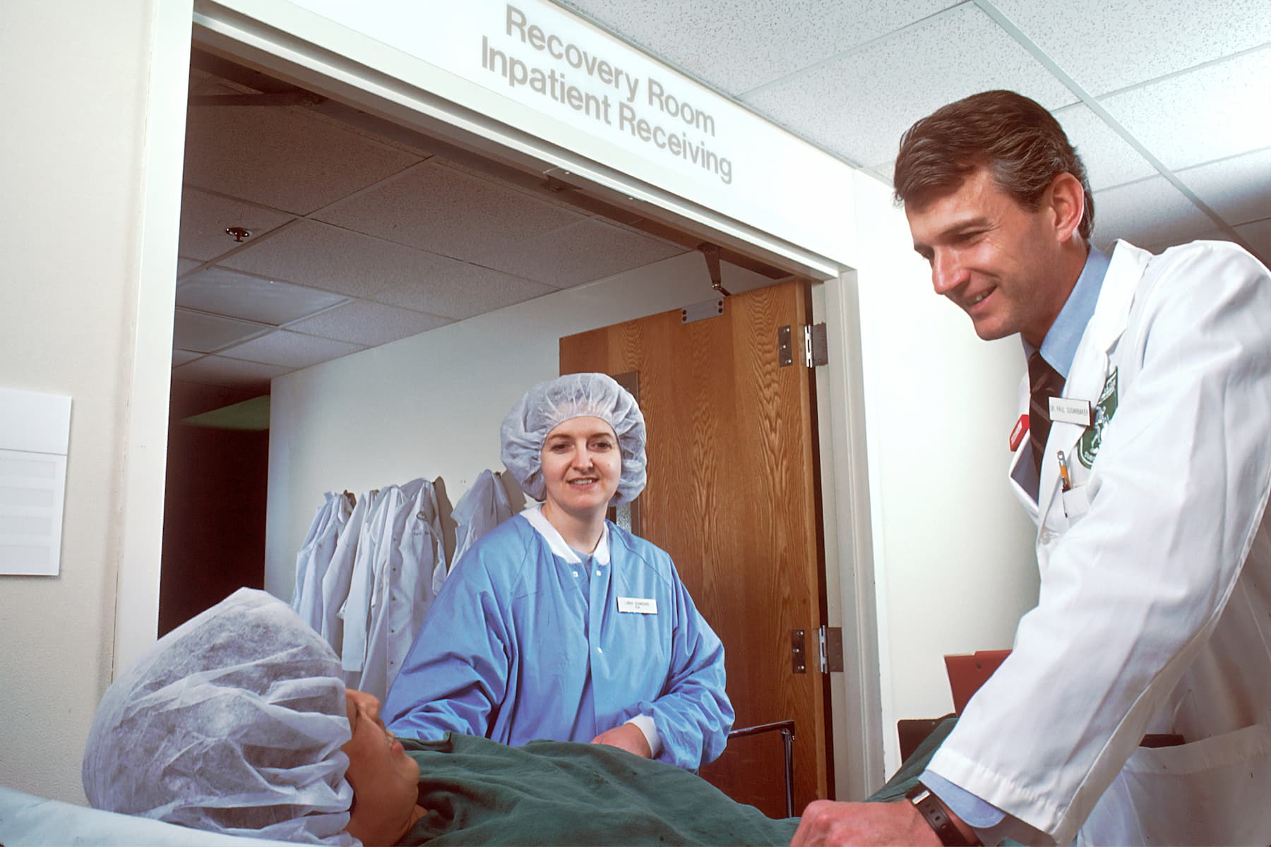 Doctor checking up on a patient after surgery