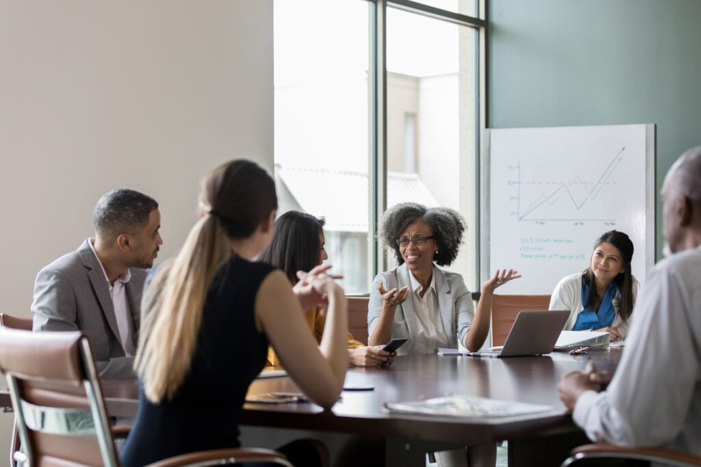 non-profit organization members attending grad school and discussing projects